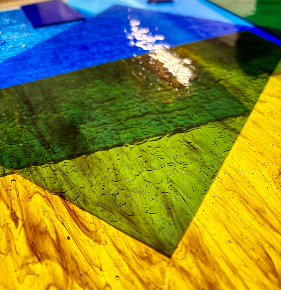 selection of coloured glass used for stained glass art